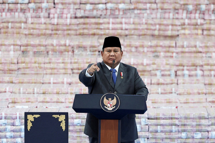 President&nbsp;Prabowo&nbsp;Subianto gestures on April 10 while delivering a speech in front of stacks of banknotes representing fines paid by companies found to have operated illegally in forest areas, during a ceremony marking the work of his forestry task force that has led to a crackdown on illegal plantations and mines, at the Attorney General&rsquo;s Office (AGO) in Jakarta.