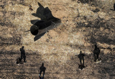 A drone view shows members of military engineering teams working at the site where, according to local authorities, an Iranian missile fell in the countryside near Damascus, Syria, June 9, 2026.