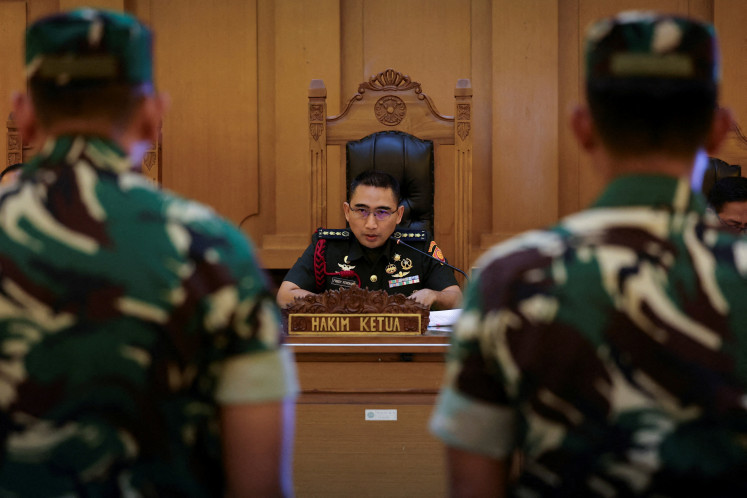Col. Fredy Ferdian Isnartanto, who leads the panel of judges in the trial over the acid attack on human rights activist Andrie Yunus, reads the verdicts for the military personnel Sami Lakka, Nandala Dwi Prasetya, Budhi Hariyanto Widhi Cahyono, and Edi Sudarko--the defendants in the case--at the military court in Jakarta, June 10, 2026.