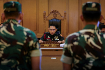 Col. Fredy Ferdian Isnartanto, who leads the panel of judges in the trial over the acid attack on human rights activist Andrie Yunus, reads the verdicts for the military personnel Sami Lakka, Nandala Dwi Prasetya, Budhi Hariyanto Widhi Cahyono, and Edi Sudarko--the defendants in the case--at the military court in Jakarta, June 10, 2026.