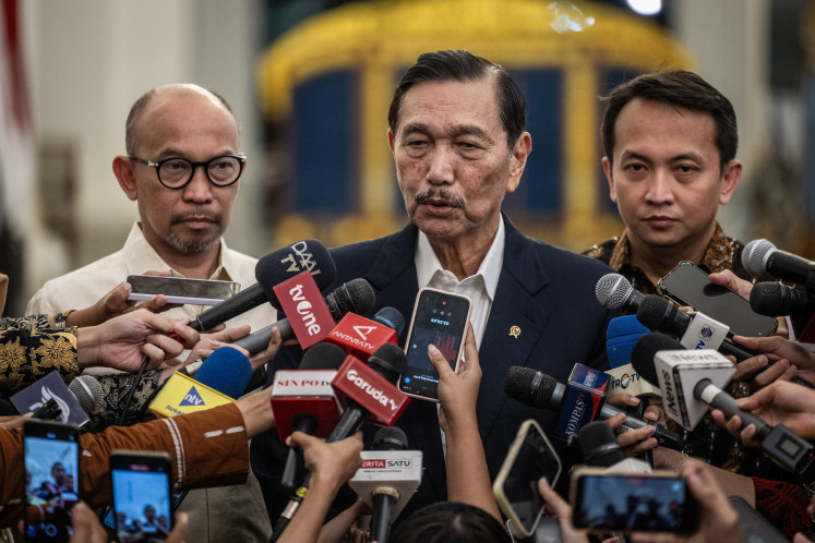Luhut Binsar Pandjaitan, center, chairman of the National Economic Council (DEN), speaks to reporters alongside DEN Executive Secretary Septian Hario Seto, right, and DEN member Chatib Basri, left, after a meeting with Indonesian President Prabowo Subianto at the Merdeka Palace complex in Jakarta, Indonesia, on June 9, 2026. The council reported to the president on its review of the Free Nutritious Meals (MBG) program and developments related to GovTech Indonesia, an initiative aimed at integrating government digital services through a national portal. 
