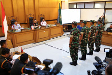 Second Sgt. Edi Sudarko (from left), First Lt. Budhi Hariyanto Widhi Cahyono, Capt. Nandala Dwi Prasetya and First Lt. Sami Lakka stand in the courtroom on June 10, 2026, for their sentences at the Jakarta Military Court in the case of the acid attack on rights activist Andrie Yunus.