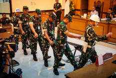 Four Indonesian Military (TNI) personnel found guilty of throwing acid at human rights activist Andrie Yunus leave after their verdict hearing on June 10 at the Jakarta Military Court.