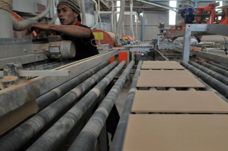 A worker works at a ceramics firm, PT Arwana Citramulia, in Serang, Banten. 