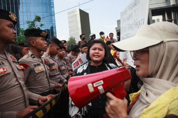 University students protest against a steep rise in non-subsidized fuel prices and the government&rsquo;s budget waste, urging authorities to halt the free school meals program (MBG), in Jakarta on June 12, 2026. 