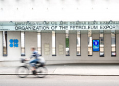 A cyclist rides past the building headquarters of OPEC (Organization of The Petroleum Exporting Countries) in Vienna, Austria on May 28, 2025.