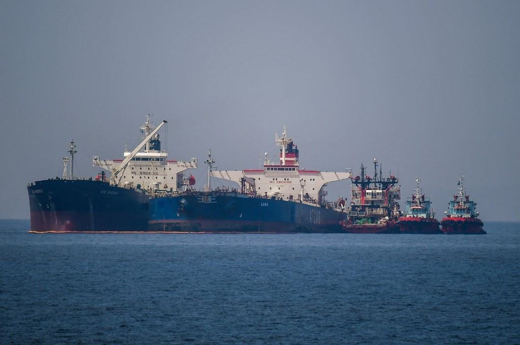 The Liberian-flagged oil tanker Ice Energy (left) transfers crude oil from the Russian-flagged oil tanker Lana (right) (former Pegas), off the shore of Karystos, on the Island of Evia, on May 29, 2022. 
