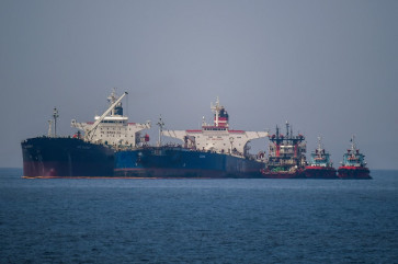 The Liberian-flagged oil tanker Ice Energy (left) transfers crude oil from the Russian-flagged oil tanker Lana (right) (former Pegas), off the shore of Karystos, on the Island of Evia, on May 29, 2022. 