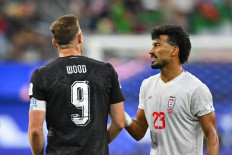 New Zealand's forward #09 Chris Wood and Iran's defender #03 Ehsan Hajsafi talk during the 2026 World Cup Group G football match between Iran and New Zealand at Los Angeles Stadium in Inglewood on June 15, 2026. 