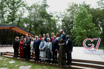  Italy's Prime Minister Giorgia Meloni, European Council President Antonio Costa, Ukraine's President Volodymyr Zelenskiy, Caroline Merotto, wife of Switzerland's President Guy Parmelin, Japan's Prime minister Sanae Takaichi, Swiss Federal President Guy Parmelin, Brazil's Rosangela &ldquo;Janja&ldquo; da Silva, Brazil's President Luiz Inacio Lula da Silva, South Korea's President Lee Jae-myung, France's President Emmanuel Macron, South Korea's first lady Kim Hea Kyung, French President's wife Brigitte Macron, British Prime Minister's wife Victoria Starmer, U.S. President Donald Trump, Britain's Prime Minister Keir Starmer, India's Prime Minister Narendra Modi, Canada's Prime Minister Mark Carney, Canadian Prime Minister's wife Diana Carney, European Commission President Ursula von der Leyen, German Chancellor's wife Charlotte Merz, European Commission President's husband Heiko von der Leyen, Germany's Chancellor Friedrich Merz, Kenya's first lady Rachel Ruto and Kenya's President William Ruto pose for a family photo before a cultural performance and concert during the G7 summit, in Evian-les-Bains, France, June 16, 2026.

