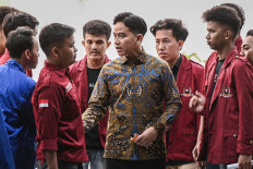 Vice President Gibran Rakabuming Raka (center) talks with student protesters after receiving them in a meeting at the Vice Presidential Palace in Central Jakarta on June 15, 2026. In the meeting, Gibran reportedly took notes of their concerns in a small notebook. 