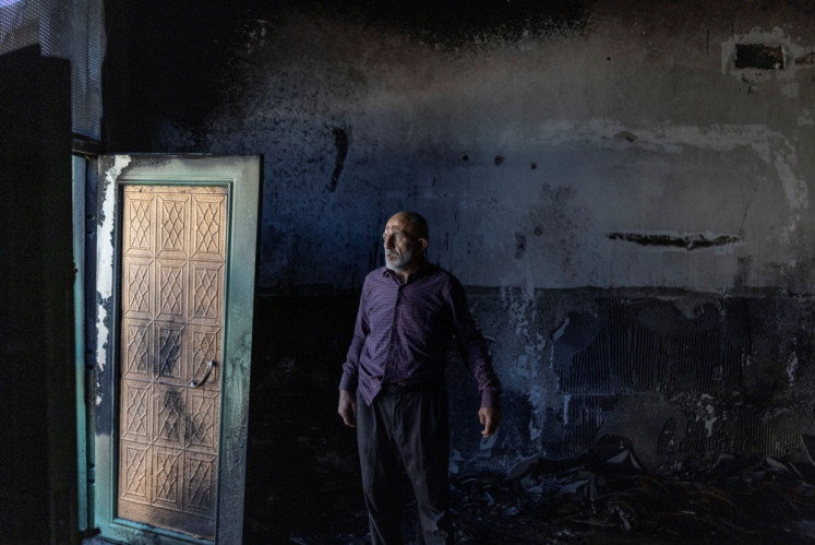 A Palestinian man inspects the damage inside a mosque reportedly burnt by Israeli settlers overnight, on June 17 in the Israeli occupied West Bank village of Jiljlia, just north of the West Bank city of Ramallah. The expansion of West Bank settlements has been a policy under successive Israeli governments but has accelerated under the current prime minister's coalition, which is backed by the far-right. More than 500,000 Israelis now live in the West Bank, excluding east Jerusalem, in settlements that are illegal under international law, among some 3 million Palestinians. 