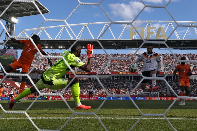 Germany's forward #26 Deniz Undav (second right) scores his team's first goal during the 2026 World Cup Group E football match between Germany and Ivory Coast at the Toronto Stadium in Toronto on June 20, 2026.  