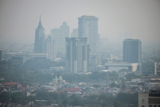The city skyline is enveloped in pollution haze in Jakarta on May 7, 2026.