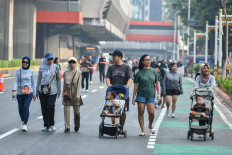 People walk for their health along Jl. Rasuna Said in South Jakarta during Car Free Day on June 21, 2026.