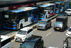 An image shows a Transjakarta bus stopping at the Senayan Bank Jakarta bus stop in the Senayan area of South Jakarta, on April 16, 2026. 
