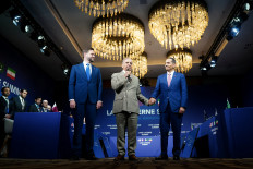 US Vice President JD Vance looks on as Pakistan's Prime Minister Shehbaz Sharif speaks while holding the hand of Qatar's Prime Minister and Minister for Foreign Affairs Sheikh Mohammed bin Abdulrahman bin Jassim Al-Thani at the start of a quadrilateral meeting between the US, Iran, Pakistan and Qatar at the Lake Lucerne Summit, aimed at advancing a deal to end the Middle East conflict, at Buergenstock Resort Lake Lucerne, near Stansstad, Switzerland, June 21, 2026.