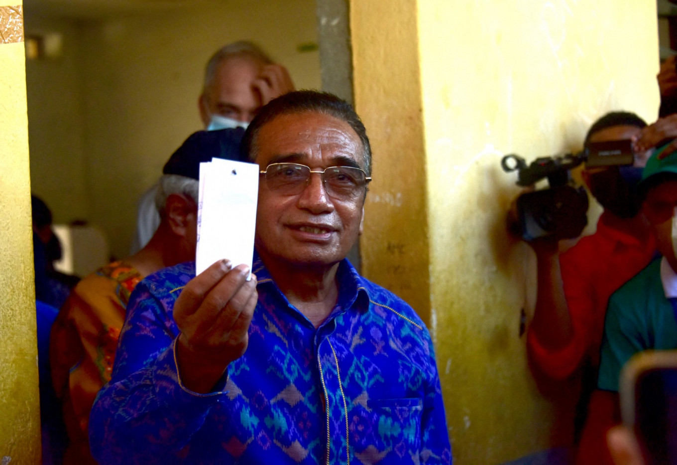 Outgoing President Francisco Guterres shows his ballot during the second round of presidential elections in Dili on April 19, 2022. 