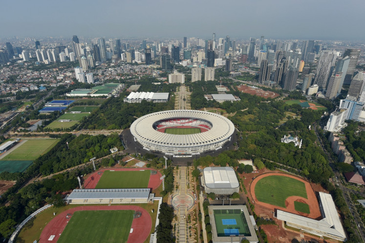 This aerial picture taken from a helicopter shows a general view of the sport facilities at the Gelora Bung Karno stadium (center) and other fields and venues for the upcoming 2018 Asian Games in Jakarta on March 29, 2018. 