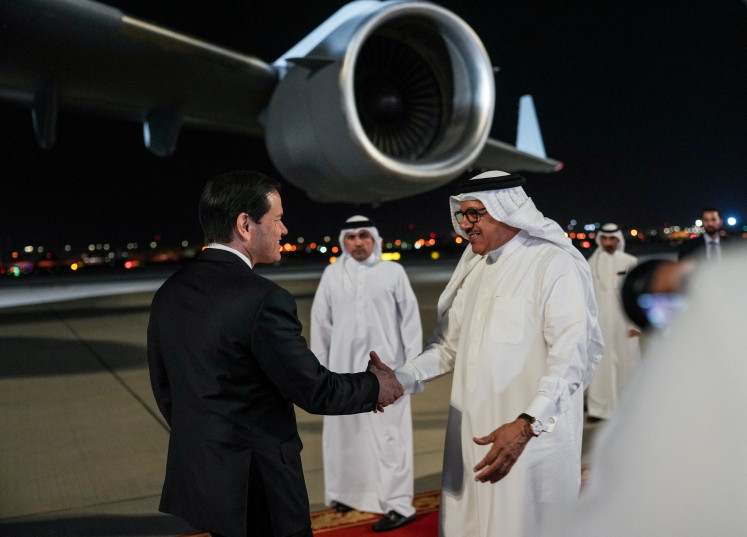 Bahrain's Foreign Minister Abdullatif bin Rashid Al Zayani greets US Secretary of State Marco Rubio upon arrival at Bahrain International Airport during his visit to the Middle East to discuss the interim deal between the US and Iran with Arab Gulf allies, in Muharraq, near Manama, Bahrain, June 24, 2026.