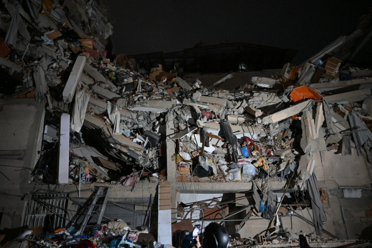 View of a collapsed building following an earthquake in Caracas on June 24, 2026. Two earthquakes of magnitude 7.2 and 7.5 struck the same area of Venezuela on the evening of June 24, causing buildings to collapse, according to the United States Geological Survey (USGS) and AFP journalists. 