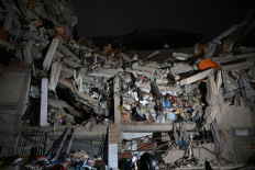 View of a collapsed building following an earthquake in Caracas on June 24, 2026. Two earthquakes of magnitude 7.2 and 7.5 struck the same area of Venezuela on the evening of June 24, causing buildings to collapse, according to the United States Geological Survey (USGS) and AFP journalists. 