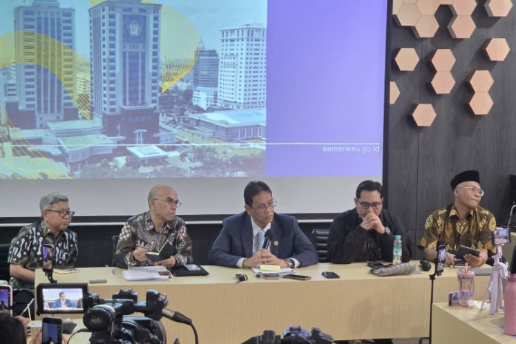 Finance Minister Purbaya Yudhi Sadewa speaks on Friday during a media briefing in Jakarta.
