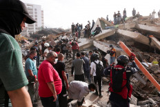 Firefighters and volunteers work amidst the rubble of a collapsed building in La Guaira, Venezuela on June 26, 2026 after earthquakes hit the country.