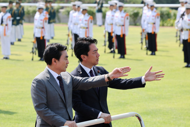Japanese Defense Minister Shinjiro Koizumi and South Korean Defense Minister Ahn Gyu-back inspect honor guards during a welcoming ceremony before their meeting at the Defense Ministry in Seoul, South Korea, June 28, 2026.
