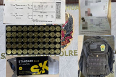 Pieces of evidence are confiscated by the police from a Portuguese woman who carried 50 .22 Long Rifle bullets in her backpack as shown in this composite picture released on June 20, 2026, by the I Gusti Ngurah Rai International Airport Police. The Portuguese woman was arrested at 11:28 p.m. local time on the same day when she was going to fly to Abu Dhabi.