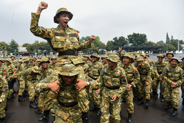 Participants in basic military training for prospective managers of the Red and White rural cooperatives chant slogans at the 1st Marine Infantry Brigade in Cilandak, Jakarta on June 25, 2026.
