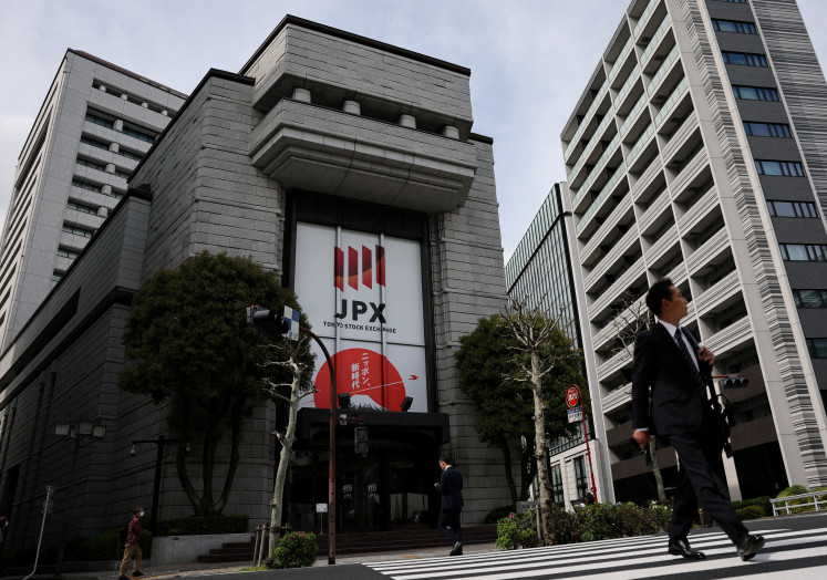 A man walks out of the Tokyo Stock Exchange building in Tokyo on April 6, 2026.