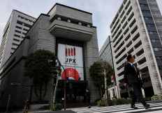 A man walks out of the Tokyo Stock Exchange building in Tokyo on April 6, 2026.