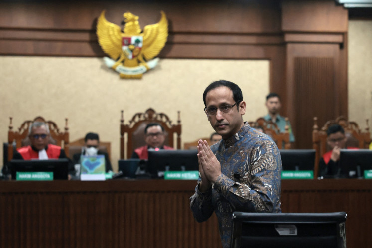 Nadiem Makarim, former education minister and cofounder of ride-hailing company Gojek, gestures on Tuesday during a verdict hearing at the Central Jakarta District Court in Jakarta in a corruption case related to the procurement of Chromebook laptops for schools during his time in office.