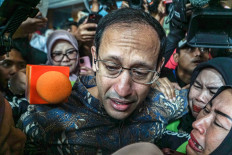 Nadiem Anwar Makarim (center), accused of corruption in the procurement of Chromebook laptops when he was education minister, arrives with supporters at the Corruption Court in Central Jakarta, on June 30, 2026. The court was scheduled to deliver its verdict in the case. 