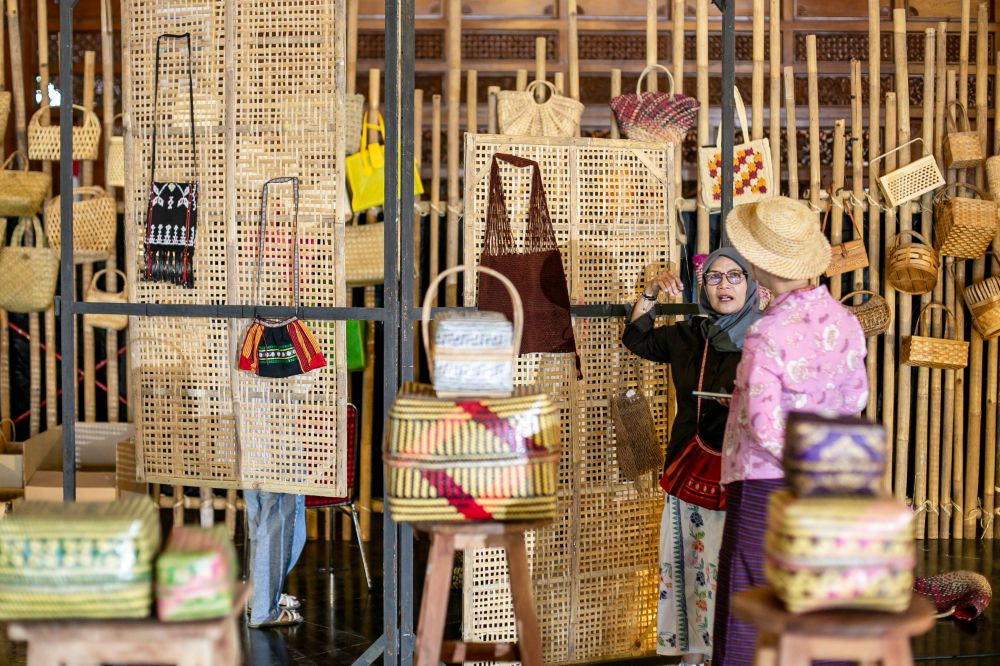 In the bag: Visitors examine handcrafted products on display during the third Nusantara Bag Festival (Festara) at City Hall in Surakarta, Central Java, on June 19, 2026. The event gathered creative entrepreneurs and the public to promote appreciation for Indonesian-made bags, strengthen the creative economy and expand market opportunities for small and medium enterprises.