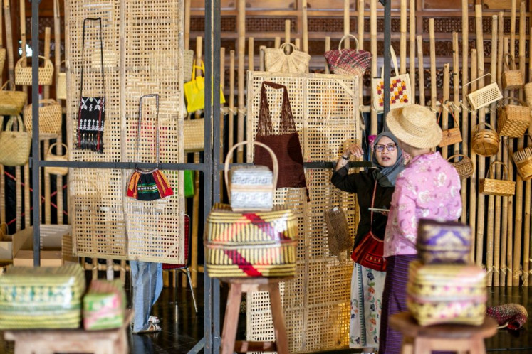In the bag: Visitors examine handcrafted products on display during the third Nusantara Bag Festival (Festara) at City Hall in Surakarta, Central Java, on June 19, 2026. The event gathered creative entrepreneurs and the public to promote appreciation for Indonesian-made bags, strengthen the creative economy and expand market opportunities for small and medium enterprises.