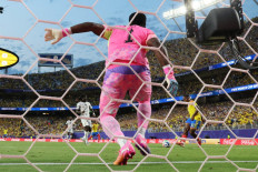 Colombia's midfielder #11 Jhon Arias (right) scores his team's first goal during the FIFA World Cup 2026 round of 32 soccer match between Colombia and Ghana at the Kansas City Stadium in Kansas City, the United States on July 3, 2026.
