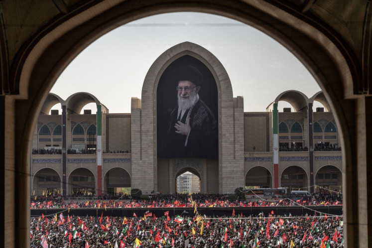 Mourners gather at the Grand Mosalla to pay their final respects to Iran's slain supreme leader Ayatollah Ali Khamenei at the start of his funeral ceremonies in Tehran on July 4, 2026. 
