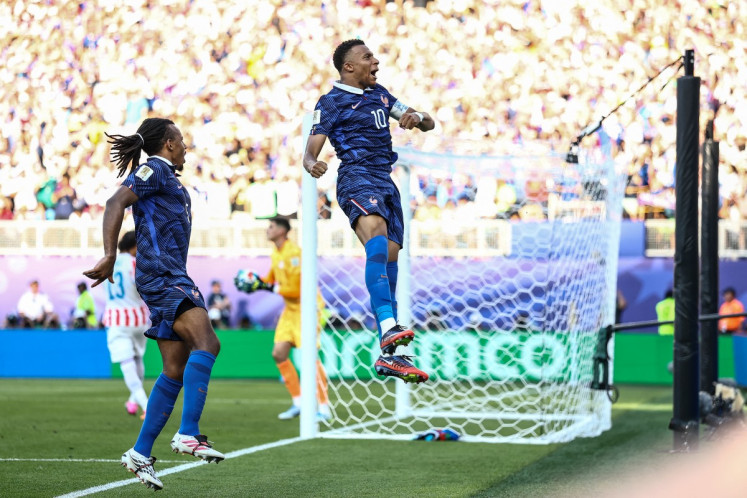 France battle past Paraguay to set up Morocco World Cup showdown