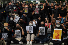 Students display placards reading &ldquo;Return the soldiers to the barracks&ldquo; during a protest against a revision to the Indonesian Military (TNI) Law in Surabaya, East Java on March 24, 2025.