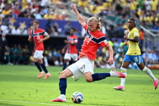 Norway's forward #09 Erling Braut Haaland kicks the ball and scores his team's second goal during the 2026 World Cup round of 16 football match between Brazil and Norway at the New York/New Jersey Stadium in East Rutherford on July 5, 2026. 