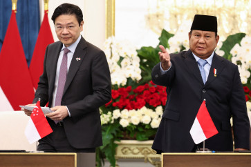 President Prabowo Subianto gestures near Singapore's Prime Minister Lawrence Wong during a joint press conference after their meeting at the Merdeka Palace in Jakarta on July 6, 2026. 