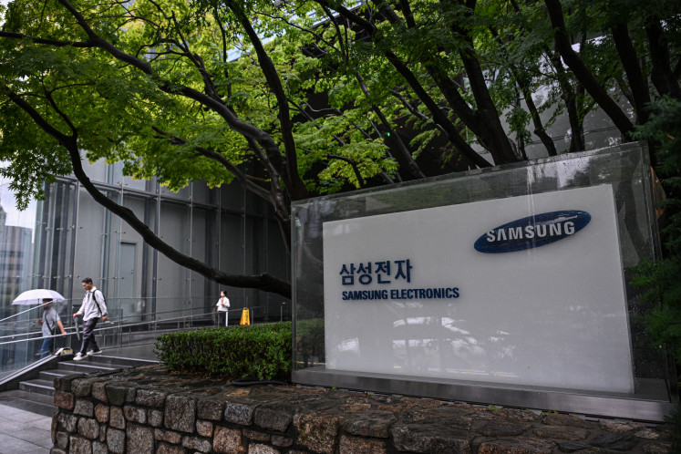 Signage of Samsung Electronics is displayed outside the company's Seocho building in Seoul on July 7, 2026.