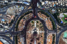 This handout satellite image released by Vantor shows large crowds of mourners congregating around Azadi Tower in Azadi Square in Tehran on July 6, 2026, during the funeral procession for Iran's slain supreme leader Ali Khamenei. 