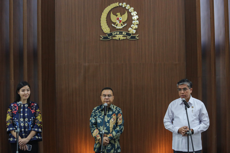Manpower Minister Yassierli (right), House of Representatives Deputy Speaker Sufmi Dasco Ahmad (center) and Tokopedia and TikTok E-Commerce Indonesia executive director Stephanie Susilo speak to reporters after a meeting at the Legislative Complex in Jakarta, on July 6, 2026.