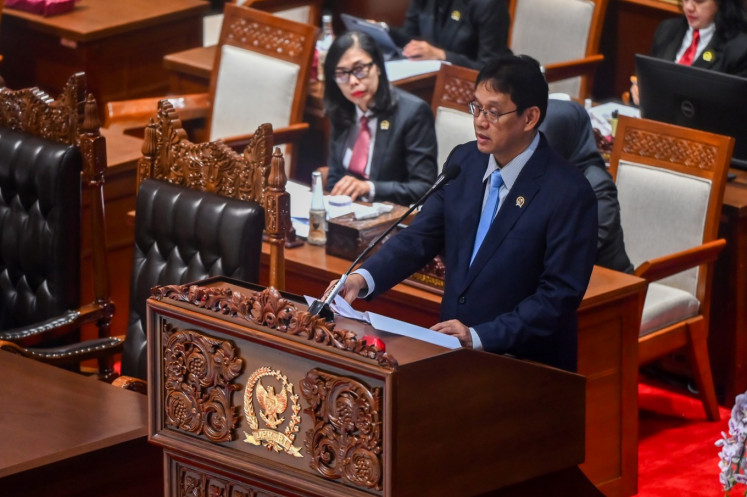 Finance Minister Purbaya Yudhi Sadewa delivers the government's final statement on behalf of President Prabowo Subianto on June 4, 2026, during a plenary session on amendments to the 2023 Financial Sector Development and Strengthening (P2SK) Law at the Senayan Legislative Complex in Central Jakarta.