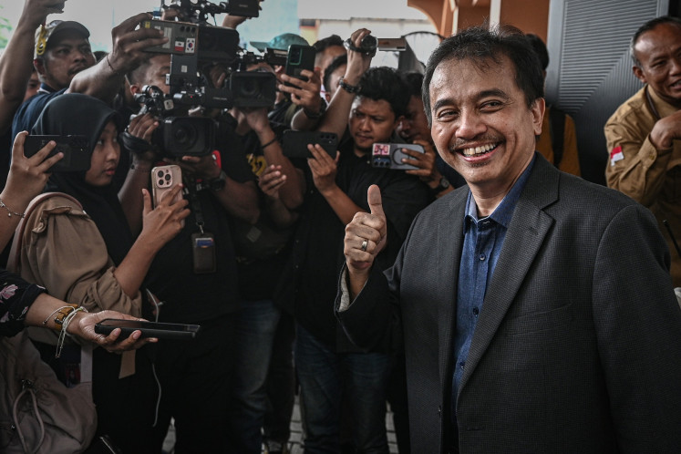 Sporting outcome: Roy Suryo (right), who served as youth and sports minister in 2013-2014, gives a thumbs-up on July 7, 2026, after a pretrial ruling in the defamation case pertaining to ex-president Joko &ldquo;Jokowi&rdquo; Widodo&rsquo;s academic credentials at the South Jakarta District Court, which declared the Jakarta Police's detention of Roy as invalid.