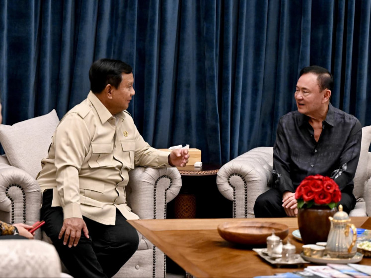 President Prabowo Subianto (left) talks with former Thai prime minister Thaksin Shinawatra on July 8 at the former's private residence at Jl. Kertanegara in South Jakarta. Prabowo and Thaksin discussed various regional and global issues during the meeting, according to Cabinet Secretary Teddy Indra Wijaya.