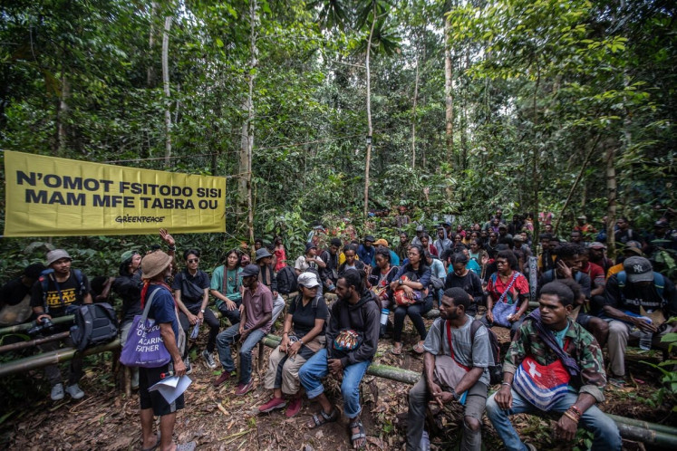 Papuan youths gather in the Knasaimos communal village forest in Manggroholo-Sira, Saifi District, South Sorong, Southwest Papua for the Forest Defender Camp, an initiative organized by Greenpeace Indonesia in collaboration with Sadir Wet Yifi and Bentara Papua from Sept. 20 to 22, 2023.